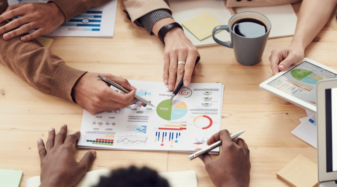 a business team reviewing charts and statistics